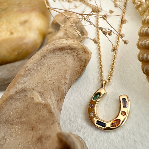 "El Dorado" Tiny Gemmed Horseshoe Charm Necklace In Gold